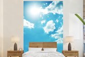 Behang - Fotobehang Zon aan een bewolkte hemel - Breedte 195 cm x hoogte 300 cm