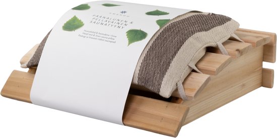 Zijaanzicht van een saunahoofdsteun met linnen kussen, voorzien van een papieren wikkel met bladmotief.