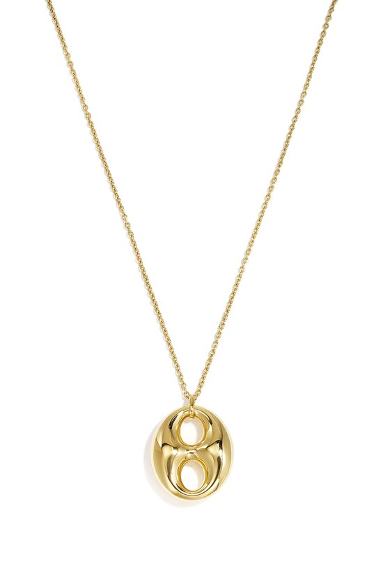 Collier à maillons dorés avec un pendentif rond et creux.