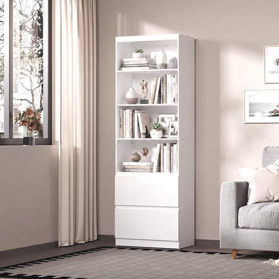 Witte boekenkast met vijf open vakken en twee lades onderaan, gevuld met boeken, vazen en decoraties.