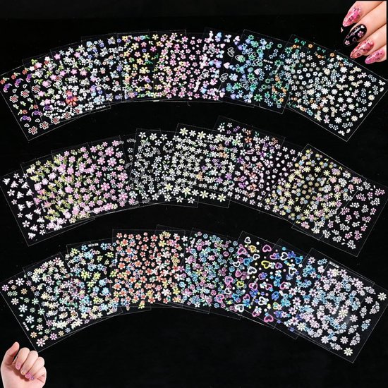 Veel vellen met nagelstickers met kleine bloemen en hartjes in verschillende kleuren, waaronder roze, paars en blauw.
