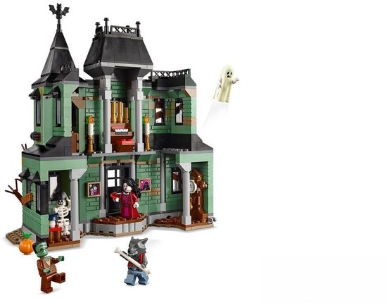 Maison hantée LEGO verte avec squelette, zombie, loup-garou, vampire et fantôme. Incluant une citrouille et un arbre.