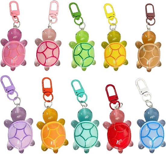 Dix petits porte-clés tortue translucides de différentes couleurs dont rose, vert, jaune, marron, violet, orange, turquoise, rouge et bleu.