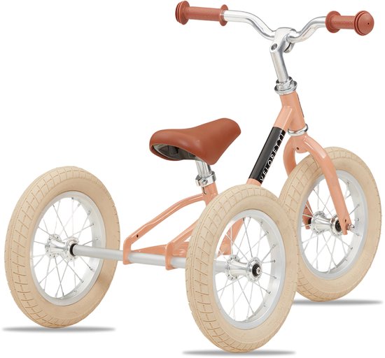 Roze driewieler met bruin zadel en handvatten, beige velgen.