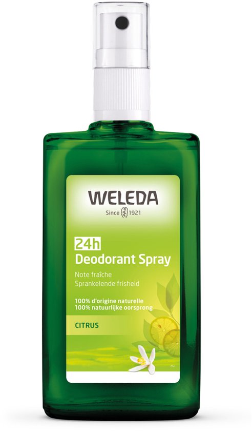 Groene Weleda Citrus Deodorant Spray fles met witte dop en een label met citroenen en een bloem.