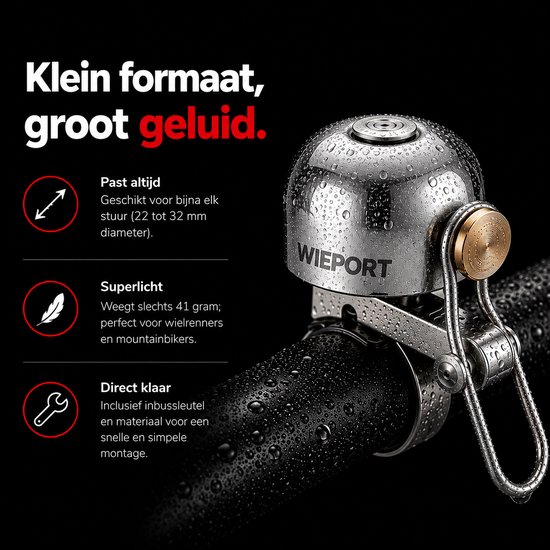 Zilveren, waterdruppels-bedekte fietsbel met gouden knop op stuur.