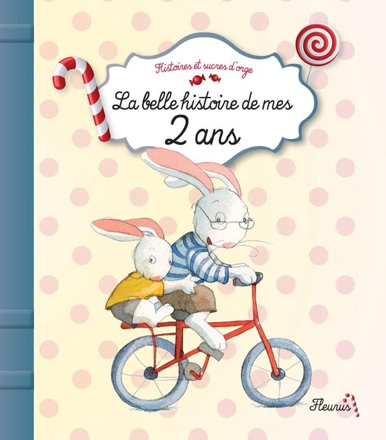 Boek kaft met twee konijnen op een fiets. Tekst: 'La belle histoire de mes 2 ans'. Gekleurde achtergrond.