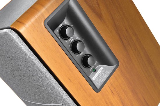 Regelaars voor treble, volume en bass op de zijkant van een Edifier R1280DB houten luidspreker.