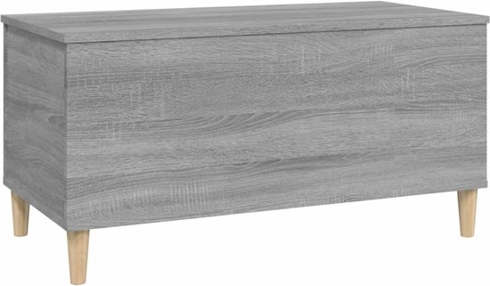 Grijze salontafel met houtnerf, gesloten, op houten pootjes, zijaanzicht.