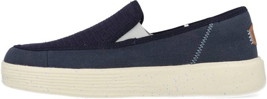 Mocassin décontracté bleu marine avec tige en textile et semelle mouchetée.