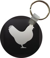 Sleutelhanger - Een illustratie van een kip op een zwarte achtergrond - Plastic - Rond - Uitdeelcadeautjes