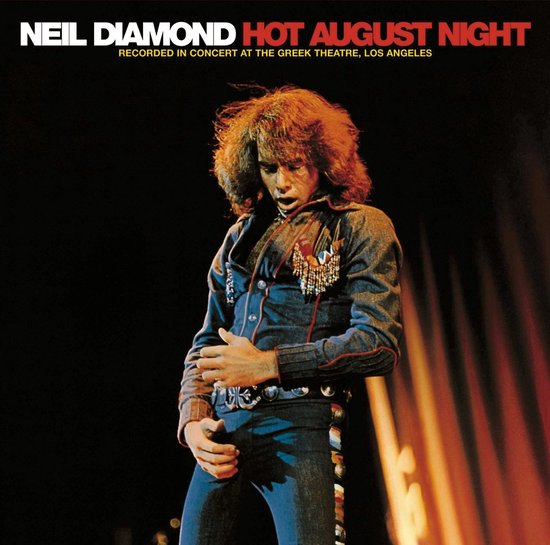 Neil Diamond albumhoes met 'Hot August Night' tekst. Neil Diamond draagt een spijkerjack en broek.