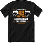 42 Jaar Legend T-Shirt | Goud - Wit | Grappig Verjaardag en Feest Cadeau Shirt | Dames - Heren - Unisex | Tshirt Kleding Kado | - Zwart - L