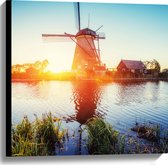 WallClassics - Canvas - Zonlicht langs Hollandse Molen aan het Water - 60x60 cm Foto op Canvas Schilderij (Wanddecoratie op Canvas)