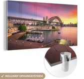 MuchoWow® Glasschilderij 120x60 cm - Schilderij acrylglas - Zonsopgang achter de Sydney Harbour Bridge in Australië - Foto op glas - Schilderijen