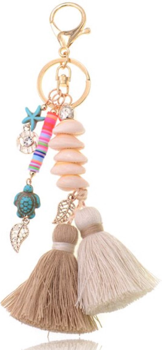 Handgemaakte Ibiza sleutelhanger goudkleurig beige bruin met schelpjes