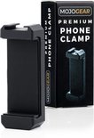 Zwarte MOJOGEAR premium telefoonhouder naast de verpakking. De houder is een verstelbare klem voor smartphones.
