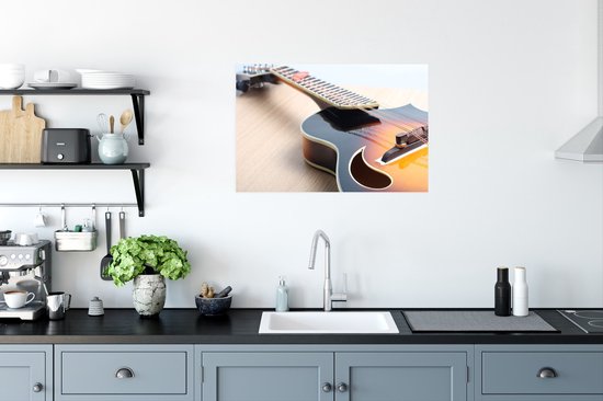 Une guitare électrique sur un plancher en bois Poster 90x60 cm - Tirage photo sur Poster (décoration murale salon / chambre)