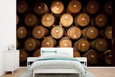 Behang - Fotobehang Wijnvaten in een wijnkelder - Breedte 525 cm x hoogte 350 cm