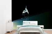Behang - Fotobehang Nachtverlichting op het Empire State Building - Breedte 415 cm x hoogte 300 cm