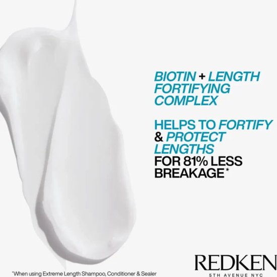 Een veeg witte crème naast tekst over Biotin + Length Fortifying Complex en 81% minder breuk.