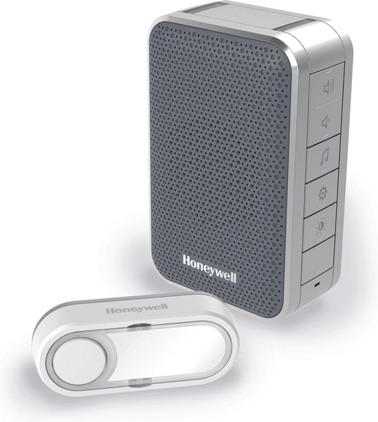 Honeywell draadloze deurbel met drukknop en ontvanger. De ontvanger is zilver met een grijs rooster. De drukknop is wit en ovaal.