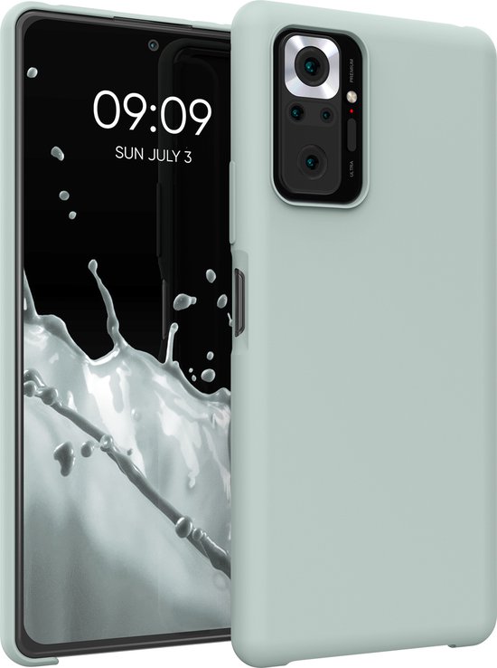 Coque de téléphone vert menthe ouverte avec un smartphone à écran de démarrage.