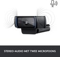 Webcam Logitech C920 noire avec accents bleus, avec des icônes indiquant le son stéréo.