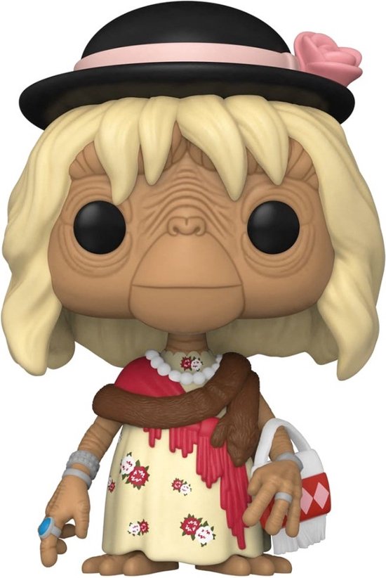 E.T. vinyl figuur in verkleedkostuum met blond haar, hoed, bloemenjurk en bruine sjaal.