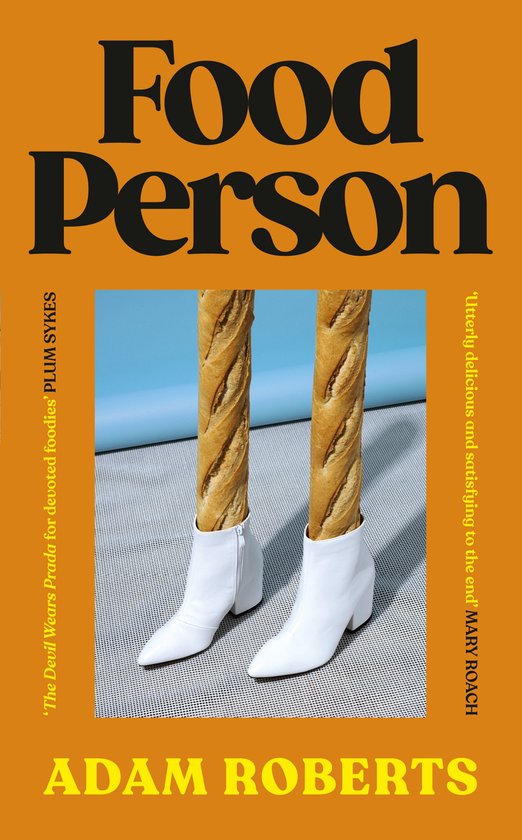 Boek 'Food Person' met op de voorkant twee stokbroden in witte laarsjes, met oranje achtergrond en zwarte tekst.