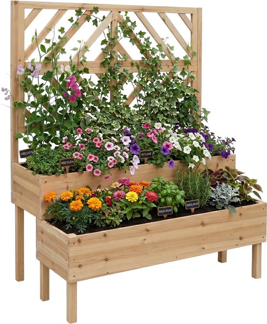 Houten bloembak met 2 niveaus en klimrek, vol met diverse bloemen en planten.
