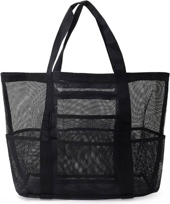 Sac de plage noir en mesh avec des anses et plusieurs poches ouvertes sur les côtés.