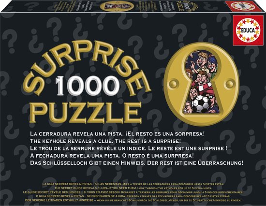 Doos van een Educa 1000-delige 'Surprise Puzzle' met de tekst "¡SORPRESA!", afbeelding van kinderen door een sleutelgat.