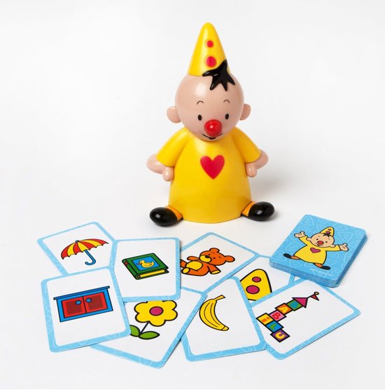 Gele Bumba-figuur met rode neus, rode hart op borst, gele puntmuts en witte stippen. Kaarten met o.a. paraplu, boek, beer, banaan en bloem.
