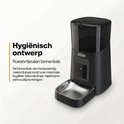 Zwarte automatische voerbak met roestvrijstalen binnenbak en "Hygiënisch ontwerp".