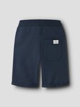 Donkerblauwe shorts met een elastische tailleband en een opgestikte zak achteraan met een label.