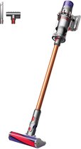 Draadloze steelstofzuiger Dyson V10 in nikkel/koper met accessoires.