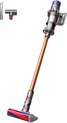 Draadloze steelstofzuiger Dyson V10 in nikkel/koper met accessoires.