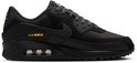 Zwarte Nike Air Max 90 sneaker met zichtbare luchtkussentjes en gele details.