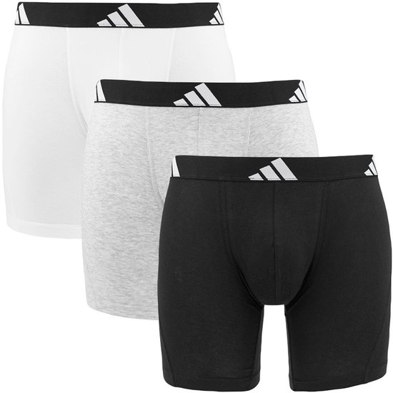 Drie Adidas boxershorts: zwart, grijs en wit, met zwarte band en Adidas logo.
