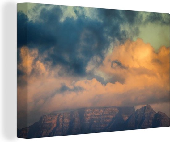 Canvas Schilderij De zon schijnt door de wolken boven de Tafelberg in Zuid-Afrika - Wanddecoratie