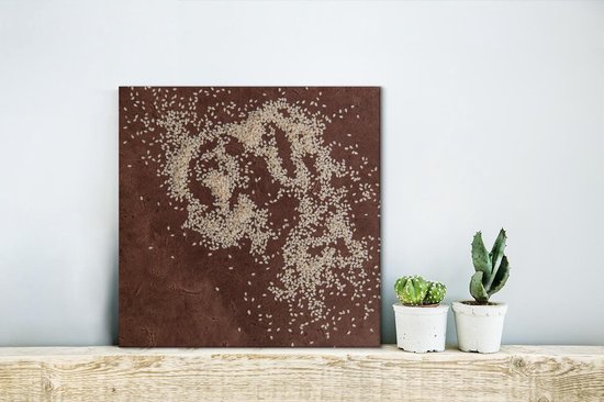 Surface marron avec des graines de sésame réparties sur la table Toile 20x20 cm - petit - Tirage photo sur toile (Décoration murale salon / chambre)