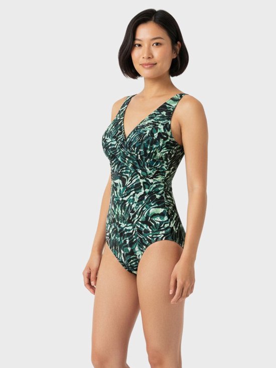 Ten Cate badpak met V-hals, gedrapeerd detail bij de buste en een groen-zwart abstract bladerpatroon.