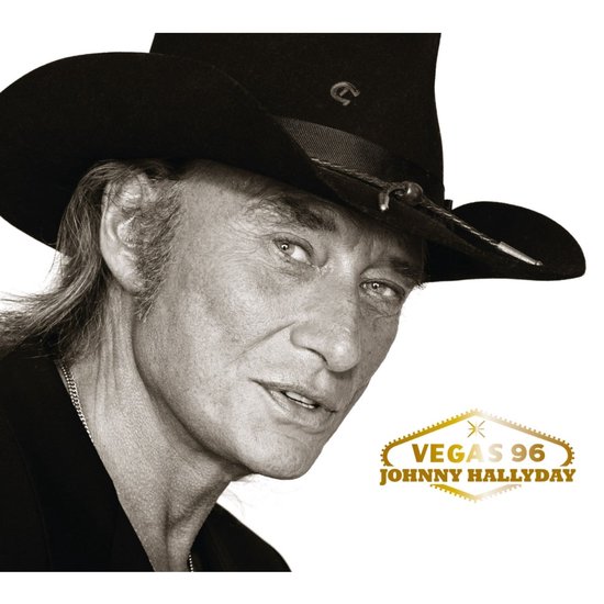 Zwart-wit portret van Johnny Hallyday met een zwarte cowboyhoed, met de gouden tekst 'Vegas 96 Johnny Hallyday'.
