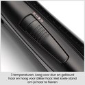 Gros plan du bouton à trois températures, incluant un réglage air frais pour fixer la coiffure.