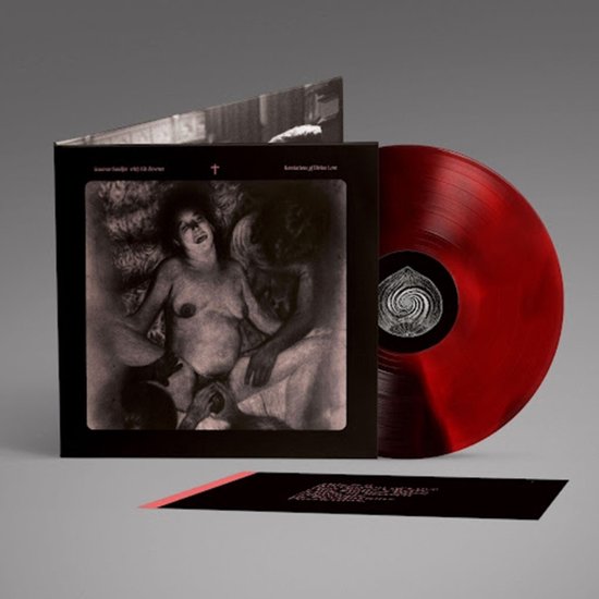 Revelations of Divine Love vinyl set met rood gemarmerde plaat en zwart-witte hoes met religieuze kunst.