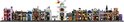 Een lange rij LEGO-winkels in diverse kleuren, waaronder paars, groen en bruin, met een witte toren in het midden.