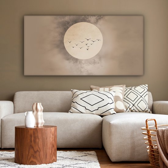 Canvas met beige achtergrond, zachte cirkel, zwerm vogels, in een woonkamer.
