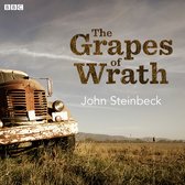 De voorkant van een roestige vrachtwagen met de tekst 'The Grapes of Wrath John Steinbeck' erop.