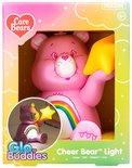Veilleuse Cheer Bear rose en boîte, avec un arc-en-ciel et une étoile jaune.